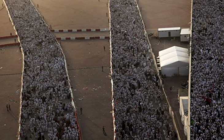 Muslim pilgrims walk on roads as they head to cast stones at pillars symbolizing Satan during the annual haj pilgrimage in Mina on the first day of Eid al-Adha, near the holy city of Mecca September 24, 2015. REUTERS/Ahmad Masood