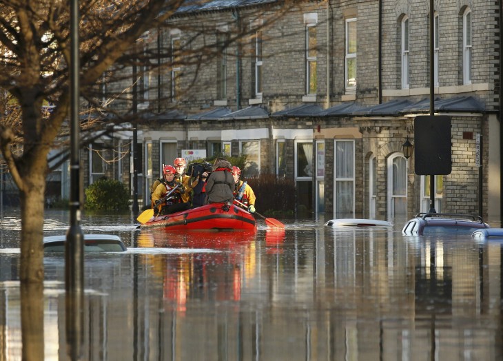 Emergency services navigate a flooded street in York, northern England, December 27, 2015.  REUTERS/Phil Noble