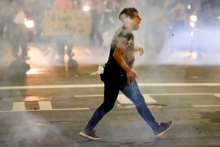 A man is hit with pepper spray paint balls in uptown Charlotte, NC during a protest of the police shooting of Keith Scott, in Charlotte, North Carolina, U.S. September 21, 2016. REUTERS/Jason Miczek     TPX IMAGES OF THE DAY