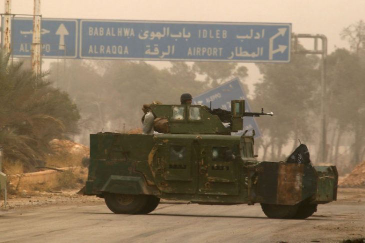 A rebel fighter rides a military vehicle in Dahiyat al-Assad, west Aleppo city, Syria October 28, 2016. REUTERS/Ammar Abdullah