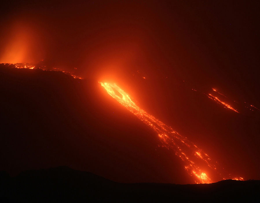 View of lava flows from Trecastagni, Zafferana, Giarre, Fornazzo as Mount Etna continues to erupt; the flows that start from the south east crater pour into the Valle del Bove 